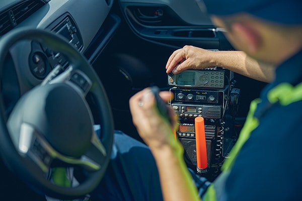 Man in workwear sitting in a car